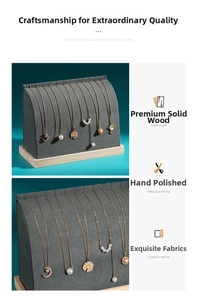 Macro detail of arc-shaped jewelry stand with gray fabric finish and solid wood base