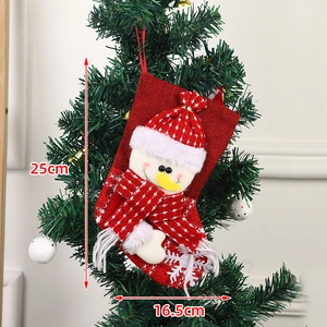 25cm red Christmas stocking with snowman decor hanging on a decorated tree
