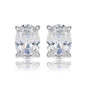 Macro shot of oval cut cubic zirconia stud earrings with silver four-prong setting