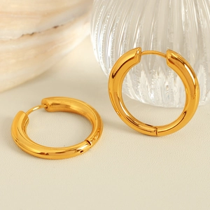 Elegant gold U-shape geometric titanium steel hoop earrings on aesthetic background