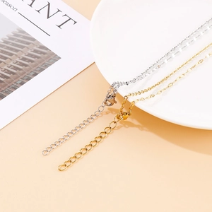 Gold and silver stainless steel key pendant necklaces with adjustable lobster clasp detail