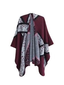 Detail of burgundy and grey knitted shawl with floral motifs and high-quality edge stitching