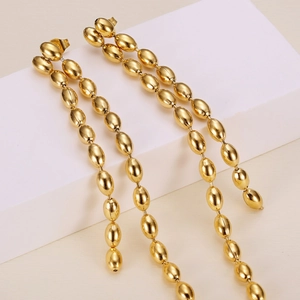 Elegant gold titanium steel tassel earrings with layered oval link design for women