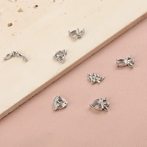 Detailed macro view of assorted stainless steel strawberry and grape jewelry claw settings