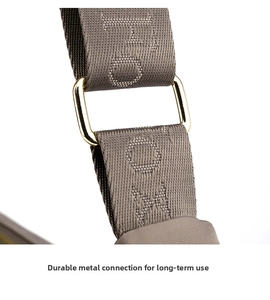 Detailed close-up of durable nylon shoulder strap with gold metal buckle and embroidery