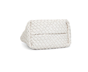 Detailed bottom view of white hand-woven leather bucket bag showing craftsmanship