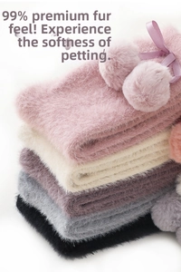 Detail of plush winter socks in pink and grey showing thick faux mink fur and cute bows