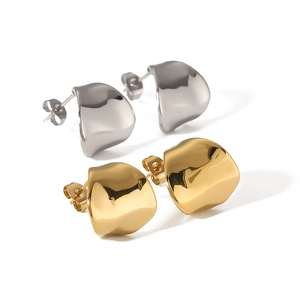 Modern wavy geometric titanium earrings in gold and silver finish with polished surface