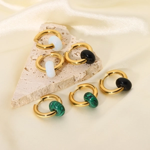 Detailed view of 18K gold stainless steel hoop earrings with colorful stone charms