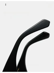 Close-up of curved temple tips on black sunglasses designed for ergonomic comfortable wear