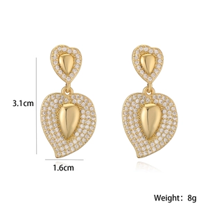 Detailed view of 18K gold plated heart drop earrings with dimensions 3.1cm by 1.6cm
