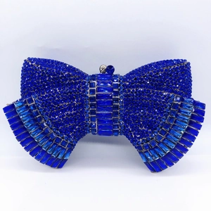Luxurious blue bow-shaped evening clutch bag encrusted with sparkling navy blue rhinestones