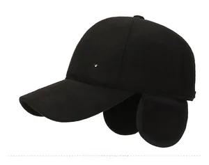 Detail of winter baseball cap featuring ear flaps and M 1992 metal side shield logo