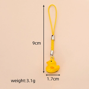 Detail view of yellow duck pendant with size dimensions 9cm by 1.7cm and strap