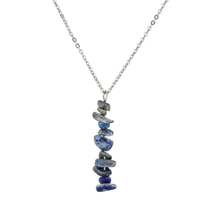 Detailed view of silver necklace featuring stacked blue lapis lazuli stones and colorful cubic zirconia