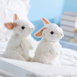 Realistic white plush rabbit doll in a cozy home setting for kids' comfort and play