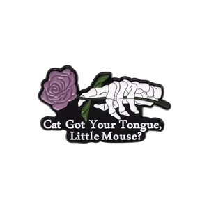 Cat Got Your Tongue enamel pin with skull hand holding a purple rose flower