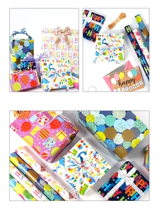 Detailed view of birthday gift wrapping paper set with ribbons and greeting cards