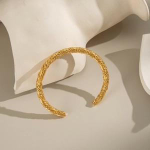 Elegant 18K gold-plated stainless steel twisted open bangle bracelet in a minimalist style