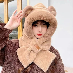 Detail view of the warm plush hooded scarf with cute bear ears and a leather tag