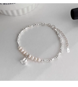 Detail of s925 silver lily of the valley bracelet with freshwater pearls and bamboo links