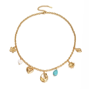 18K gold plated stainless steel necklace with turquoise beads and mixed charms on white base