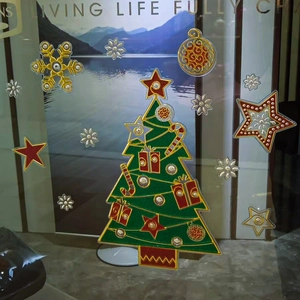 Green Christmas tree glass window sticker with golden stars and snowflakes decorations