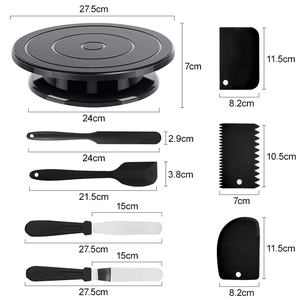 Black rotating cake turntable set with spatulas and scrapers including dimension markings