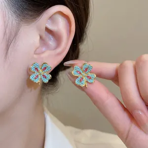 Vintage style four-leaf clover stud earrings with blue beads and red crystals for women