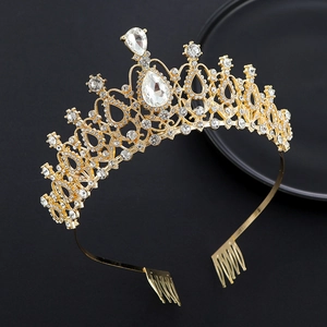 Macro detail of golden crystal bridal tiara with side combs and rhinestone inlay