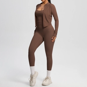 Detail of dark brown three-piece yoga set with zipper jacket and high waist leggings