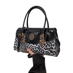 Women's leopard print tote bag with black crocodile leather and gold lion charm