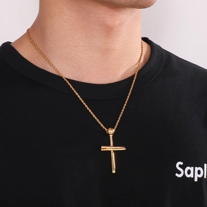 Close-up of gold 18K plated stainless steel baseball bat cross pendant with twist chain