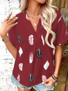 Detail of V-neck short sleeve shirt in dark red with colorful feather print patterns