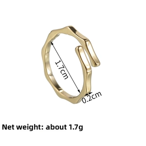 Detail of gold bamboo style titanium ring showing 1.7cm diameter and 0.2cm width dimensions