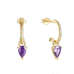 Macro shot of S925 sterling silver ear hook with purple teardrop gemstone and zircons