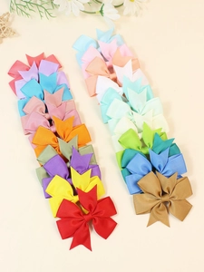 Close-up of colorful 8cm grosgrain ribbon hair bows in various candy colors for girls
