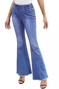 Detail of high waist flared jeans featuring distressed knee holes and frayed raw hem design