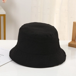 Detailed close-up of a premium black cotton bucket hat with durable fabric texture