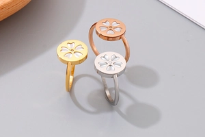 Three-color cherry blossom rings in gold silver and rose gold with white shell inlay