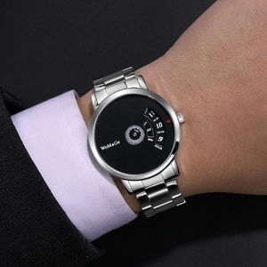 Detailed view of WoMaGe fashion rotating dial quartz watch with silver steel strap