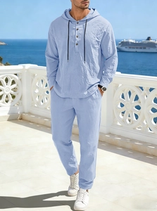 Close-up of light blue linen hoodie set fabric texture on a seaside balcony