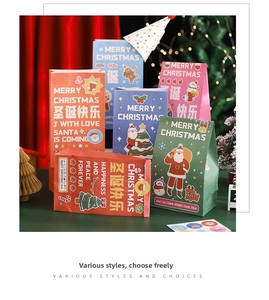 Close-up of colorful Christmas gift bags with festive patterns and heart shaped seals