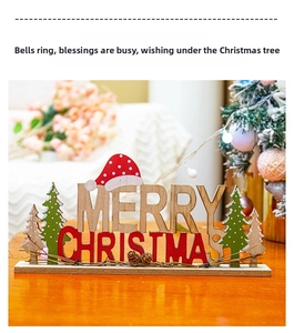 Close-up of wooden Merry Christmas desk ornament with Santa hat and pine tree details