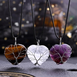 Three heart-shaped Tree of Life necklaces with Tiger Eye, Clear Quartz, and Amethyst stones