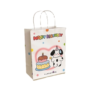 White Happy Birthday paper gift bag featuring a cute cartoon dog and sturdy paper handles