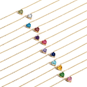 Detailed collection of 12 colorful heart-shaped crystal pendants on gold necklaces