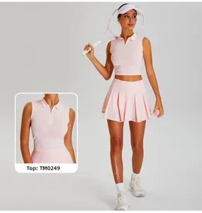 Detail view of pink sports polo top and high waisted pleated tennis skirt with zipper