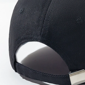 Detail view of cotton twill baseball cap back with adjustable strap and silver metal buckle
