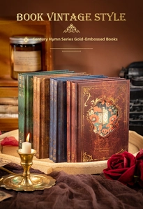 Detailed view of European vintage notebooks with gold foil patterns and antique textures
